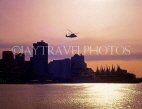 CANADA, British Columbia, VANCOUVER, Downtown skyline and helicopter, at dusk, CAN040JPL