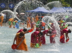 CHINA, Yunnan Province, Jinghong, Water Festival, Dai people in water fight party, CH1610JPL