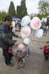 CHINA, Yunnan Province, Kunming, candy floss vendor creating his sweets by bicycle power, CH1613JPL