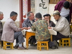 CHINA, Yunnan Province, Lijiang, ld town, people playin dominos, CH1565JPL