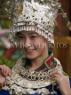 CHINA, Yunnan Province, Lijiang, woman in traditional dress silver hat, CH1480JPL