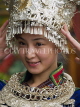 CHINA, Yunnan Province, Lijiang, woman in traditional dress silver hat, CH1584JPL