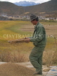 CHINA, Yunnan Province, Shangri La, Tibetan farmer sifting barley, CH1573JPL