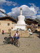 CHINA, Yunnan Province, Shangri La, woman with cart by stupa, CH1519JPL