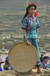 CHINA, Yunnan Province, Yuanyang, Hani (Akha) hill tribe woman with rice sifting basket, CH1622JPL