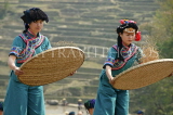 CHINA, Yunnan Province, Yuanyang, Hani (Akha) women sifting rice, during a festival, CH1624JPL