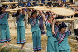 CHINA, Yunnan Province, Yuanyang, Hani (Akha) women sifting rice, during a festival, CH1632JPL