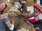 CHINA, Yunnan Province, Yuanyang, Hani hill tribe women in market, selling chickens, CH1542JPL