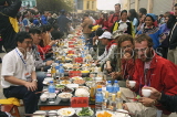CHINA, Yunnan Province, Yuanyang, Long Table Festival, people enjoying food, CH1638JPL