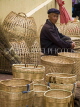 CHINA, Yunnan Province, Yuanyang market, vendor with baskets, CH1550JPL