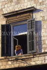 CROATIA, Dubrovnik, Old Town, woman looking out of window, CRO406JPL