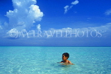 CUBA, Playa Larga, seascape, boy (tourist) swimming in shallow sea, CUB340JPL