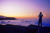 Canary Isles, TENERIFE, Puerto de la Cruz, coast at sunset and tourist, SPN1337JPL