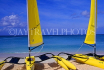 Cayman Islands, GRAND CAYMAN, Seven Mile Beach, and yellow sail catamarans, CAY225JPL