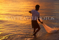 Cayman Islands, GRAND CAYMAN, fisherman dragging in net (dusk), CAY98JPL
