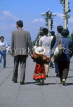 China, BEIJING, Tiananmen Square, couple with child in colourful dress, CH1190JPL