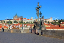 Czech Rep, PRAGUE, Charles Bridge, Holy Crucifix statue, and city view, CZ1400JPL