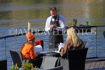 Czech Rep, PRAGUE, River Vlatava, riverside restaurant, waiter taking order, CZ1192JPL