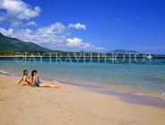 DOMINICAN REPUBLIC, North Coast, Playa Dorada beach, sunbathing couple, DR329JPL