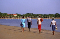 DOMINICAN REPUBLIC, North Coast, people walking along beach, DR114JPL