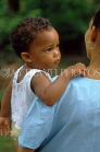 DOMINICAN REPUBLIC, Santo Domingo, mother carrying child, DR217JPL