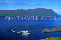 FAROE ISLANDS, Streymoy, Torshavn, seascape with boat entering harbour, FAR71JPL