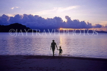 FIJI, Taveuni, Matagi (Matangi) Island, father and child on beach at sunset, FIJ767JPL