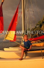 FIJI, Viti Levu, Nadi Bay area, boy seated on sailboat, FIJ878JPL