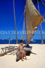 FIJI, Viti Levu, Nadi Bay area, coast, boy seated on catamaran, on beach, FIJ880JPL