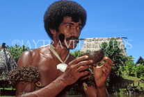 FIJI, Viti Levu, Pacific Harbour Arts Village, warrior with bowl of Kava (drink), FIJ849JPL