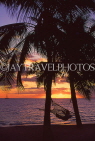 FIJI, Viti Levu Island, Coral Coast, sunset with coconut trees and hammock, FIJ937JPL