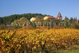 FRANCE, Languedoc-Roussillon, countryside, harvested vineyards (autumn) and small chateau, FRA978JPL