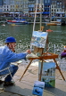 FRANCE, Normandy, HONFLEUR, artist painting local scene, in Vieux Bassin, FRA1379JPL