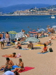 FRANCE, Provence, Cote d'Azure, CANNES, Beach and sunbathers, Old Town in background, FRA226JPL