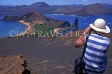 GALAPAGOS Islands, tourist photographing Bartolome Island, GAL247JPL