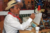 GUATEMALA, Guatemala City, artist painting, crafts, GUA263JPL
