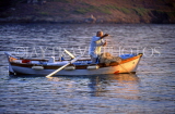 Greek Islands, AMORGOS, Katapola, fisherman dropping net from small boat, GIS676JPL