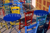 Greek Islands, ANAPHI, Aylos Nikolaos, brightly painted tables and chairs in cafe, GIS709JPL