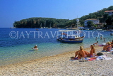 Greek Islands, CORFU, Kalami, brach with sunbathers and boat, GIS202JPL
