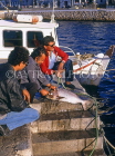 Greek Islands, CRETE, Agios Nikolaos, man scaling fish, GIS1101JPL