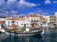 Greek Islands, CRETE, Agios Nikolaos, town and fishing boat, GIS1084JPL