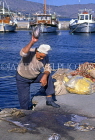 Greek Islands, CRETE, Elounda, fisherman cleaning Octopus, GIS1124JPL