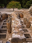 Greek Islands, CRETE, Iraklion, PALACE OF KNOSSOS, large pithoi (clay jars) in storerooms, GIS189JPL