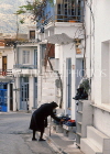 Greek Islands, CRETE, Kritsa village, houses, and, woman in black mourning attire, GIS1263JPL