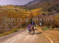 Greek Islands, CRETE, Lasithi area, farmer, and wife on donkey, along country road, GIS1063JPL