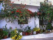 Greek Islands, CRETE, village house with flower pots and red Bougainvillea, GIS1092JPL