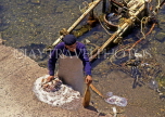 Greek Islands, KOS, Kos Town, fisherman cleaning Octopus, GIS198JPL