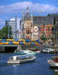 HOLLAND, Amsterdam, harbourfront, tram and Central Station in background, HOL510JPL