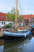 HOLLAND, Edam, old town, canalside and moored boat, HOL815JPL