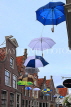 HOLLAND, Edam, old town street decorated with umbrellas, HOL819JPL
